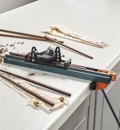 Chopstick Master Kit being used to taper a blank, with finished chopsticks beside it on the table