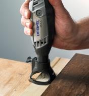 Cutting a groove in a workpiece using a Dremel 3000 rotary tool with a cutting guide attachment
