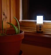 LED mini lantern illuminating a window sill
