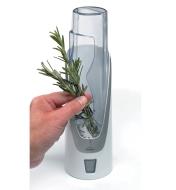 Placing fresh rosemary in the herb saver