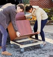 Lifting furniture off a dolly that has heavy-duty casters
