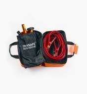 Open roadside emergency kit with collapsible shovel, booster cables and traction mats inside