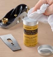 Using a soft, clean cloth to take a portion of Veritas tool wax from its container