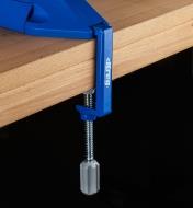 The table clamp being used to secure a Kreg pocket-hole jig to a workbench