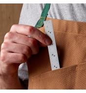 Slipping a 6" Pocket Rule into an apron pocket