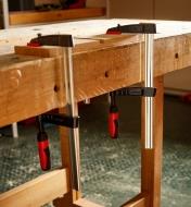 Bessey 4” light-duty FA clamps used to clamp a piece of wood to a workbench