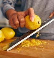 Using a Stainless-Steel Rasp to zest a lemon