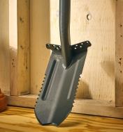 A close view of the root-cutter trenching spade’s blade, showing the bevelled tips and saw teeth