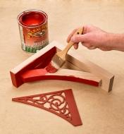 Painting the Scroll Wooden Shelf Bracket with red milk paint