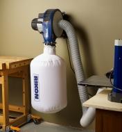 Rikon 1 hp portable dust extractor mounted on a workshop wall