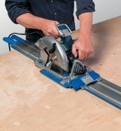 Cutting a panel with a circular saw using the saw guide
