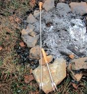 Two telescoping campfire forks, one extended to full length
