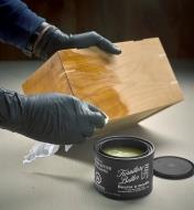 Applying Walrus Oil furniture butter to a wooden box
