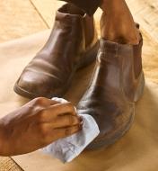 Applying Walrus Oil leather oil to a leather boot