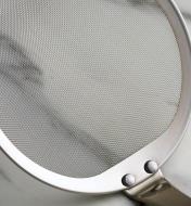 Close-up of the mesh on the fine-mesh skimming ladle