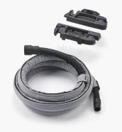 The vacuum hose enclosed in the sleeve, along with hardware fittings used to mount it on the vacuum