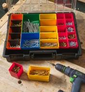 An open Allit Pro 23-compartment modular storage case holding various sizes of screws