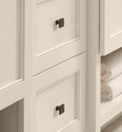 Two oil-rubbed bronze colored Appoint square knobs are connected to two white colored drawers