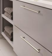 Two long satin nickel Caliber handles mounted horizontally to two drawers