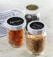 Jars with tough bands and write-on lids used to store dry food items
