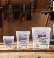 Three sizes of measuring & mixing cups on a workbench