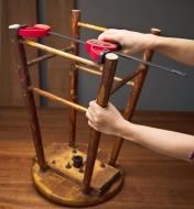 Using a squeezer/spreader clamp as a spreader to adjust the position of the legs on a wooden stool