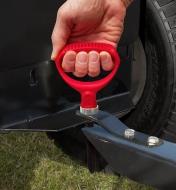 One-hand grip used to lift the magnetic hitch pin from the hitch