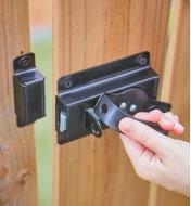 Operating the gate turn-handle latch installed on a wooden gate