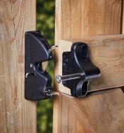 A lockable gate latch installed on a wooden gate