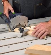 A Domino joiner used on a Veritas Domino joinery table to cut miter-joint mortises in end grain