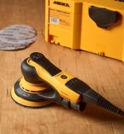 A Mirka DEROS 5 electric sander with a Systainer case and discs