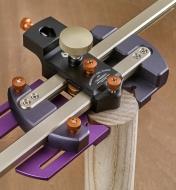 A CS-3 center scribe positioned on the end of a wooden dowel to mark its center