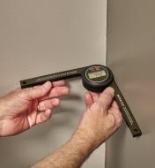 Using a digtal miter saw gauge to measure the angle of an inside corner