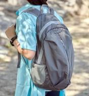 A packable backpack being worn on someone’s back