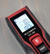A pocket laser measure displays measurements in imperial