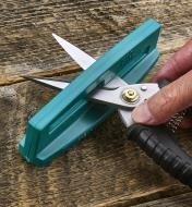 Sharpening both blades of a pair of shears using a shear and scissor sharpener