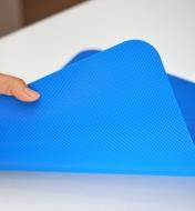 Displaying the textured underside of a flexible cutting mat