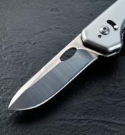 A close view of the included drop-point blade mounted on the 3-in-1 knife