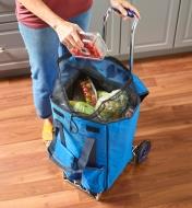 Removing groceries from the carryall