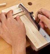 Using the miniature shooting plane and miniature shooting board to trim an end of a small workpiece