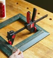 The spreader function being used to repair a picture frame