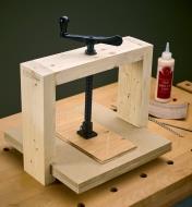 A veneer press with a single press screw