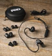 ISOtunes earbud hearing protectors displayed on a wooden surface with all included accessories
