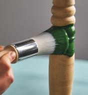 Applying paint to a spindle using the 1" round brush 