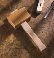 A carpenter’s beech mallet resting on a workbench