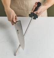 Sharpening a knife on diamond sharpening steel