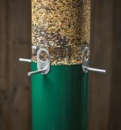 A close-up view of the squirrel-proof bird feeder’s aluminum seed ports and perches