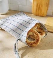 Bagels inside an open bread storage bag
