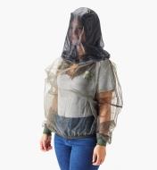 A woman wears a hooded bug-protection shirt without a hat underneath