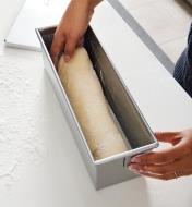 Placing bread dough in the Pullman loaf pan